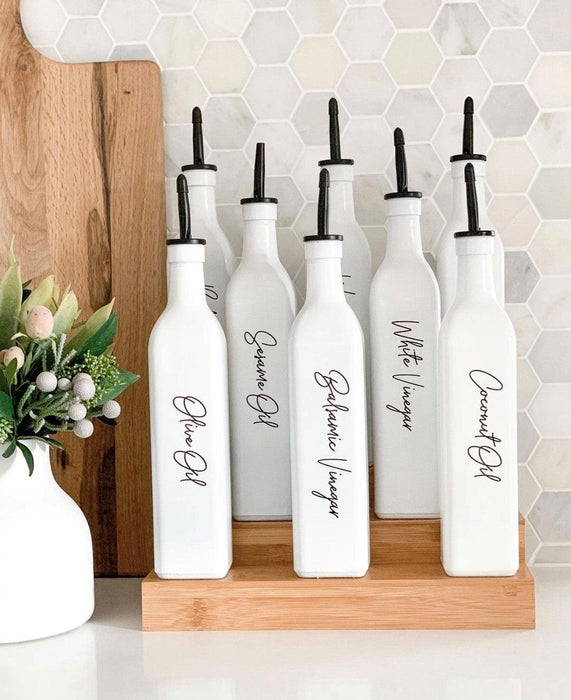 https://www.littlelabelco.com/cdn/shop/files/500ml-oil-and-vinegar-bottles-white-little-label-co-8_43a75671-234f-494c-82b3-453e1264df13_571x700.jpg?v=1753161410